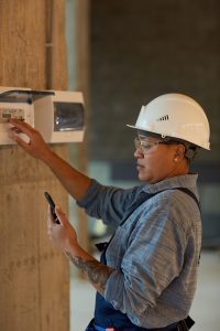 An electrical apprentice doing on the job training